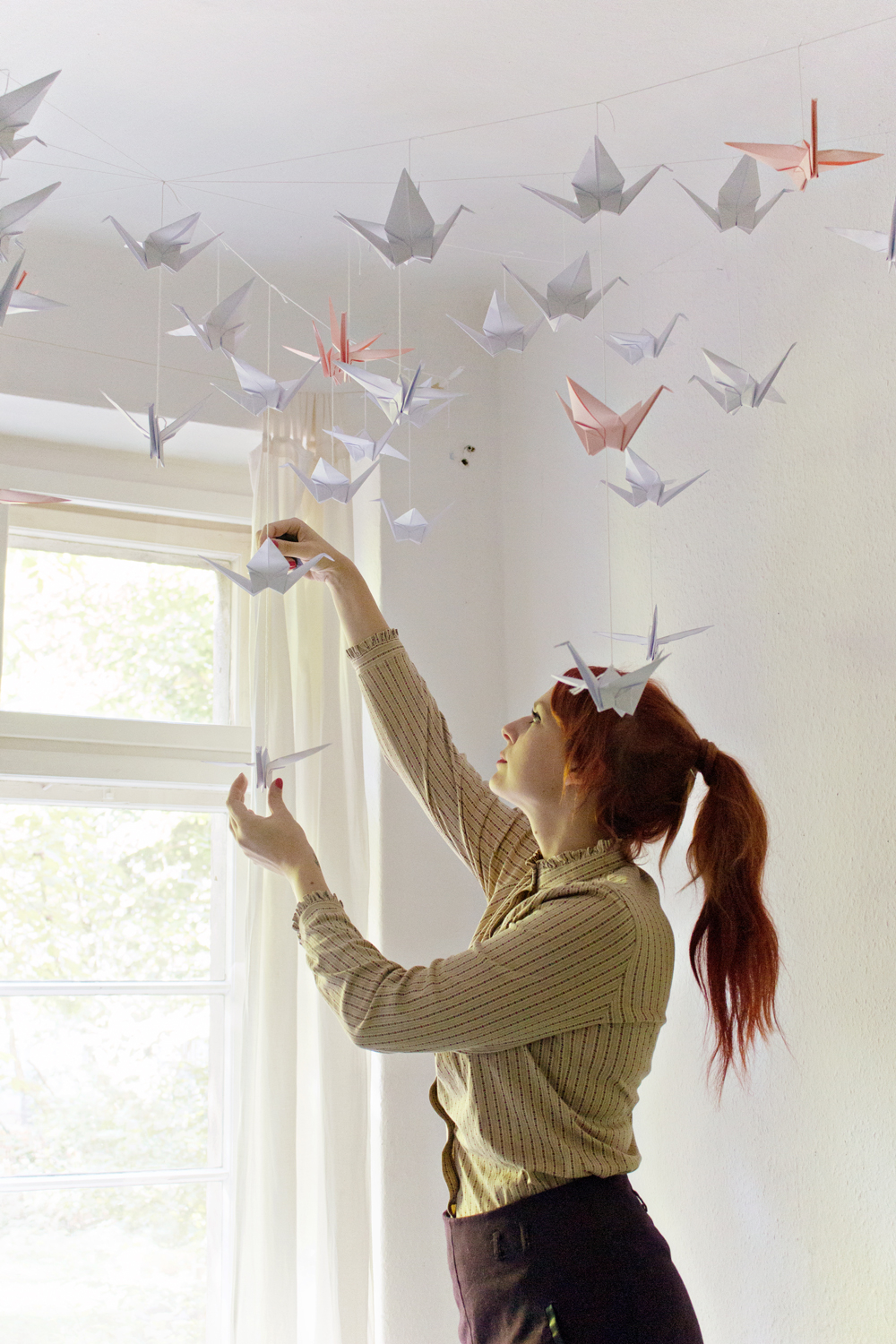 How To Make Origami Swans Diy Renters Friendly Origami Ceiling Decoration