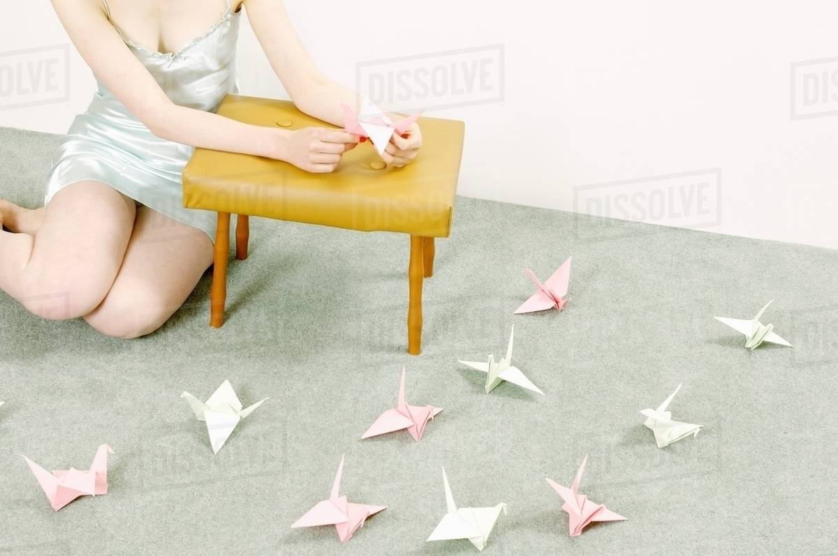 How To Make Origami Swans Woman Making Origami Swans Stock Photo
