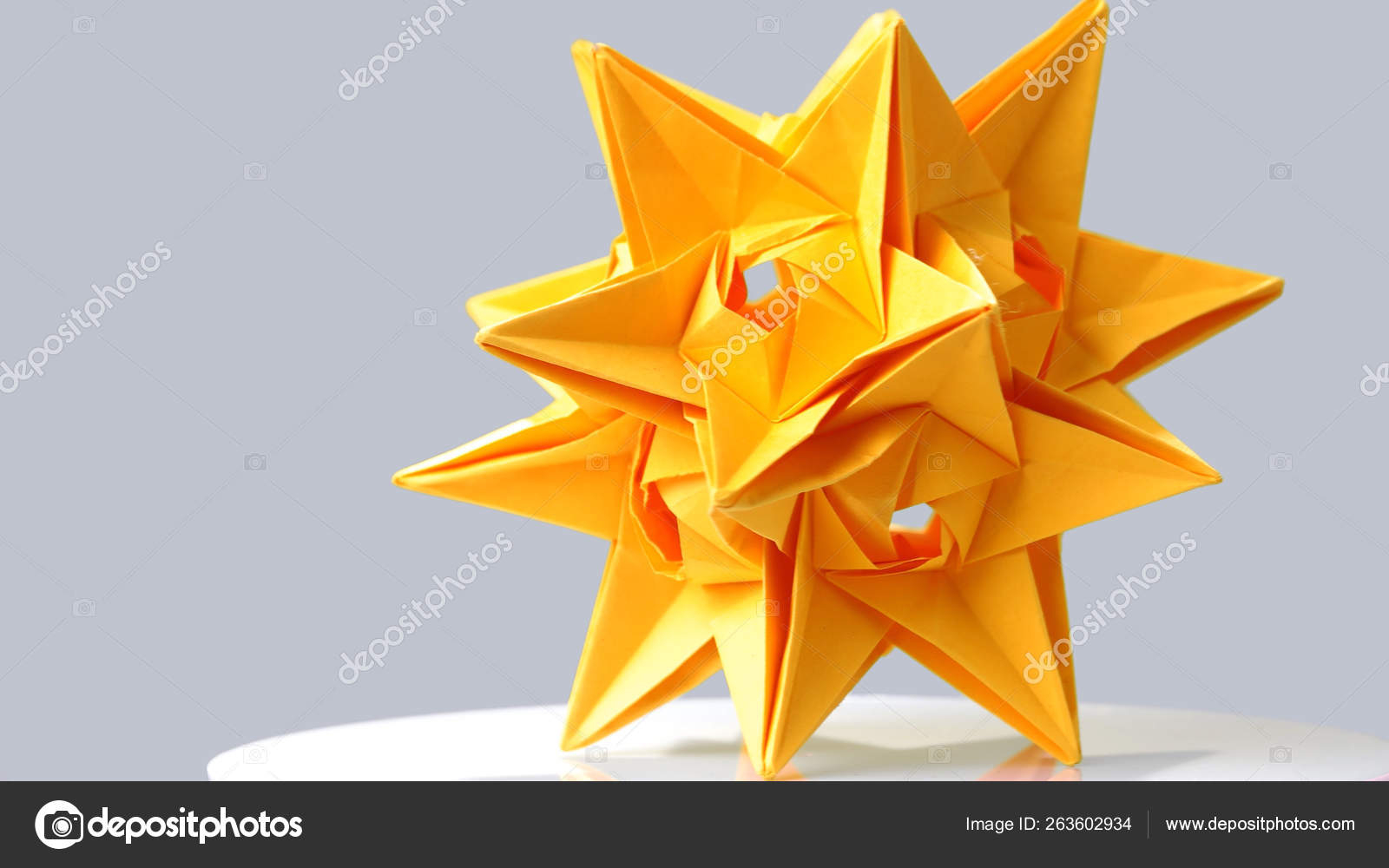 Large Origami Paper Stellated Dodecahedron Origami On Grey Background