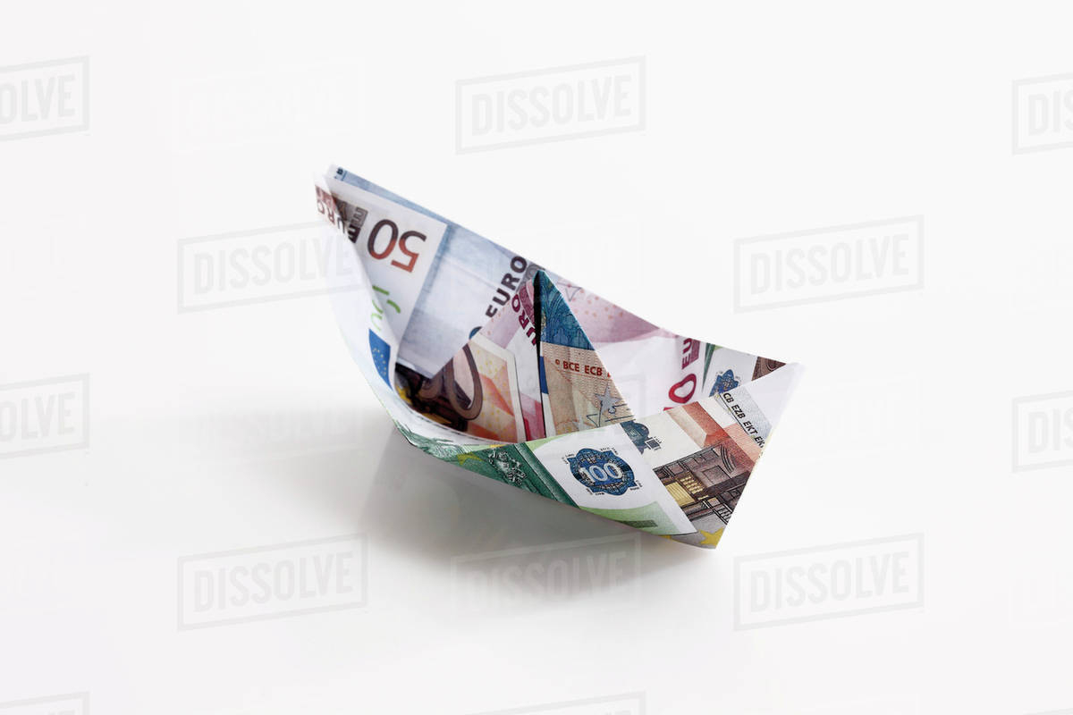 Origami Paper Boat Origami Paper Boat Of Euro Notes On White Background Stock Photo