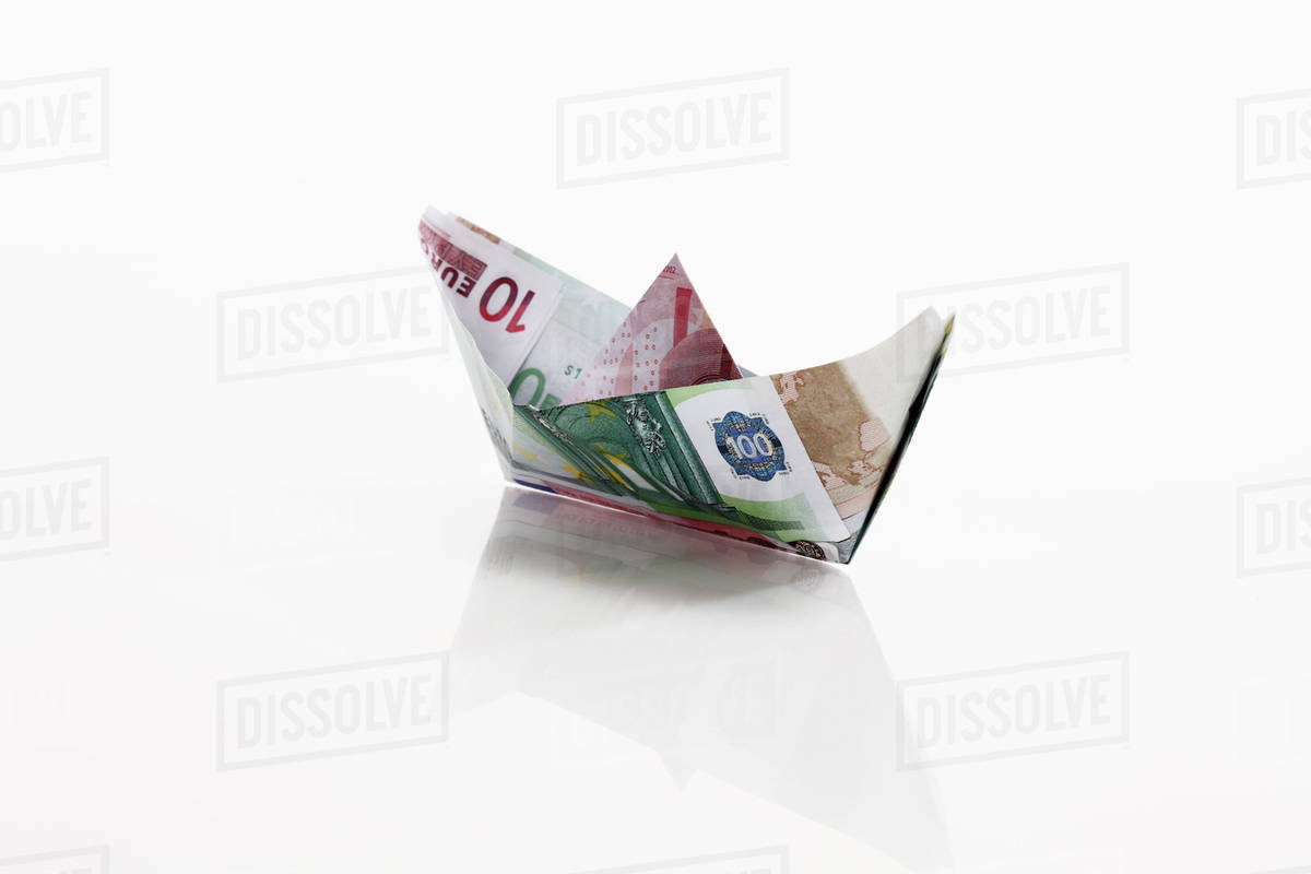 Origami Paper Boat Origami Paper Boat Of Euro Notes On White Background Stock Photo